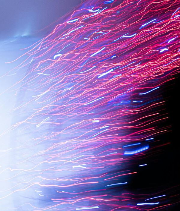 Abstract blue neon lines representing movement and energy flow